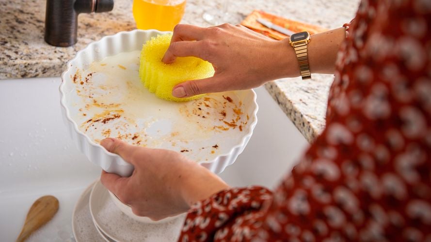 Person cleaning with the Scrub Daddy sponge.