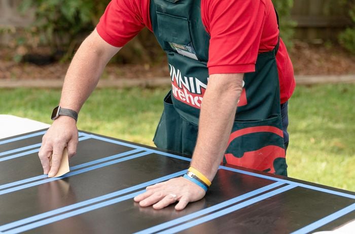 Sanding the Board so it is smooth to touch