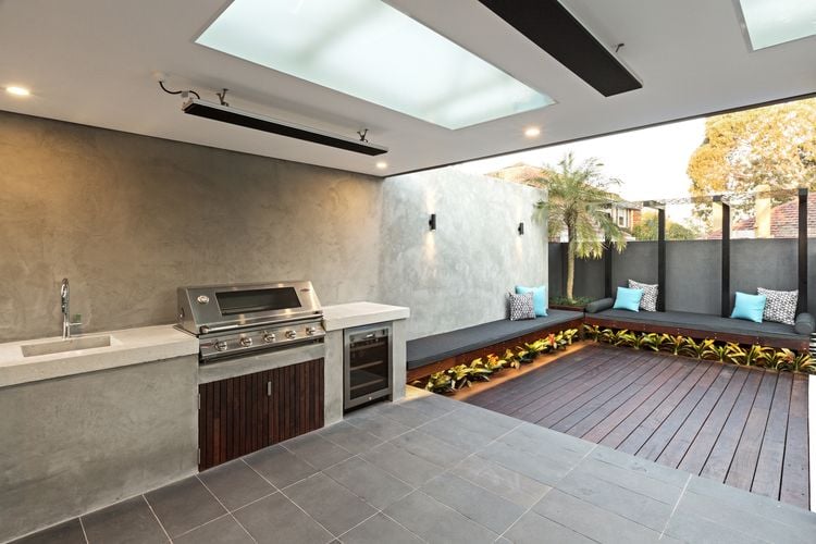 Outdoor entertainment area with barbecue and roof mounted heat lamps