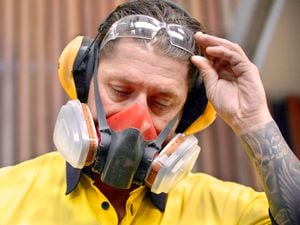 tradeperson with safety wear on