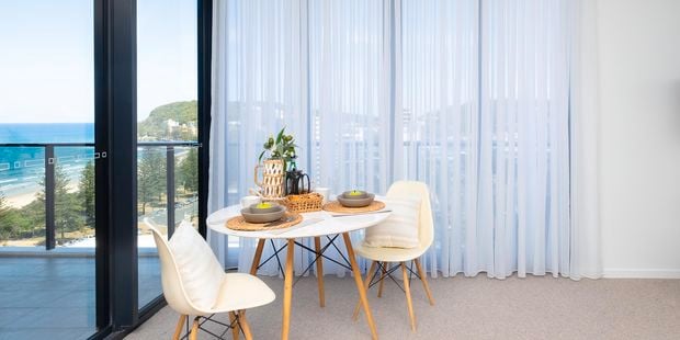 Living room with shear curtains.
