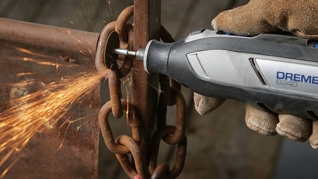 Rotary tool cutting some metal chain.