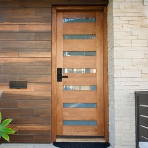 Close up of a house with a modern wooden door