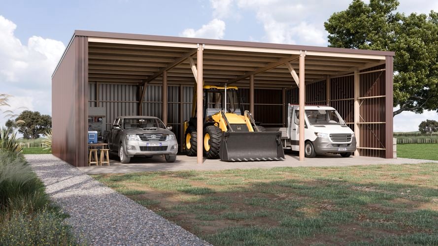 <p>Large brown open shed with vehicles and tractor.</p>