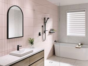 Modern pastel pink bathroom with Airstream black shower
