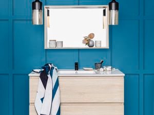 Cibo cabinetry in bathroom with blue wall