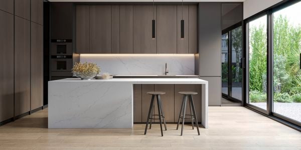 Modern brown kitchen with stone white benchtops.