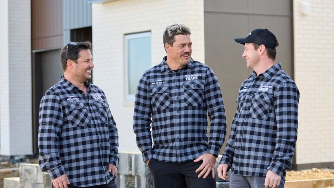 men standing together in a flannel shirt