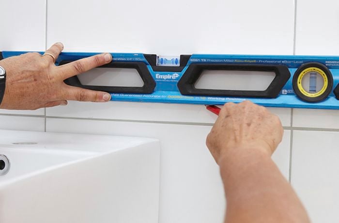 DIY Step Image - How to install a bathroom mirror . Blob storage upload.