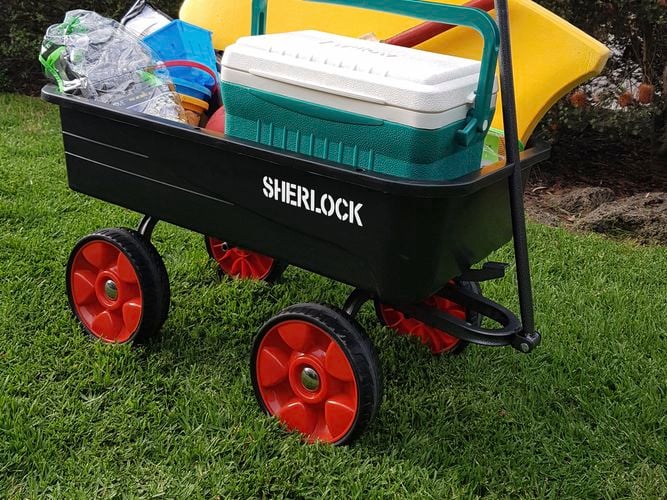 Cart loaded with esky, boogie board beach items