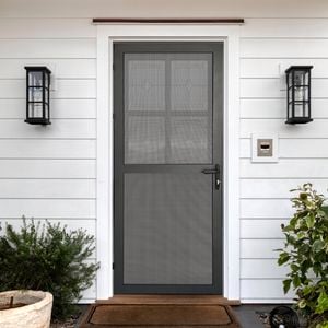 Close up of a house with a black security door