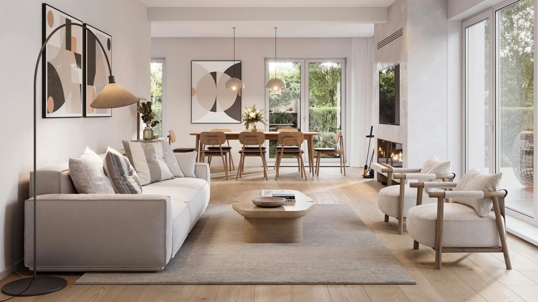 Living area with a couch and a dining table.