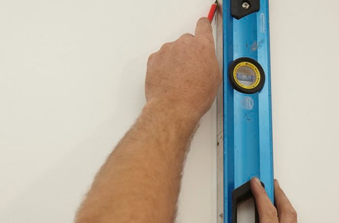 Locating the stud in the wall with a stud finder