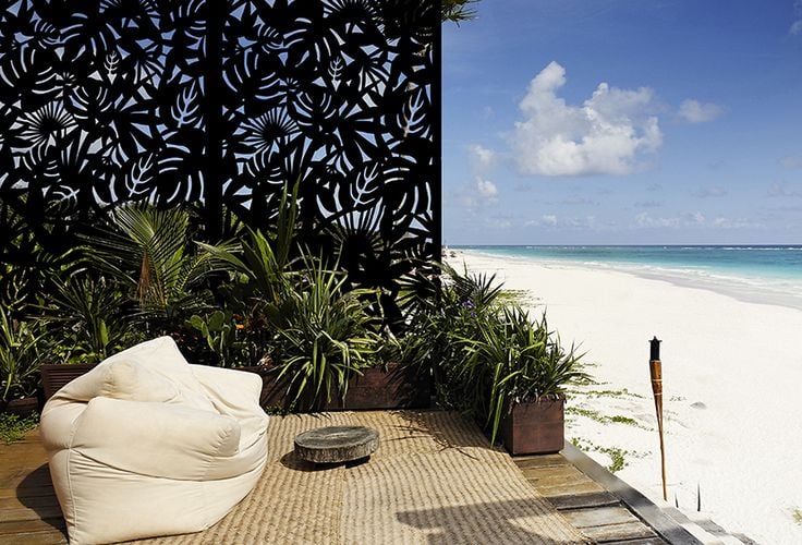 Home with beachfront access with decorative screen adding privacy