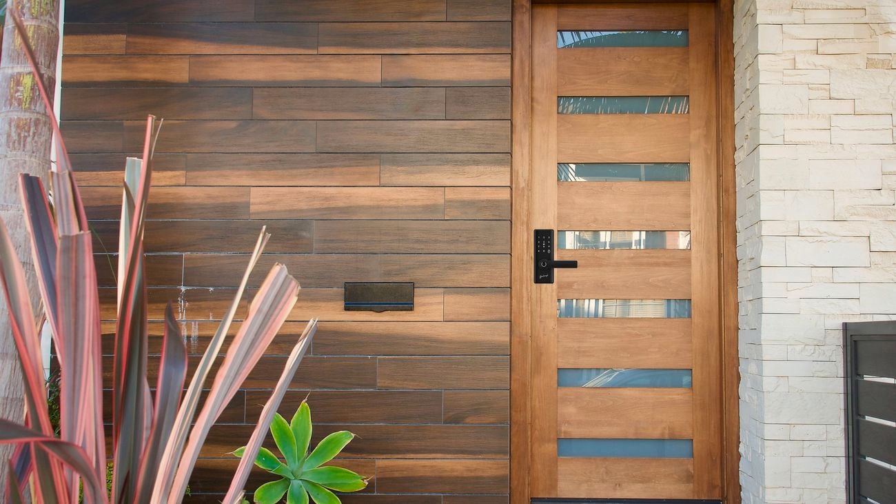 Close up of a house with a modern wooden door