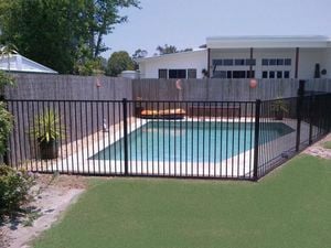 Pool with black balustrade fencing.