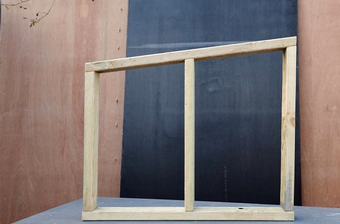 Pieces of timber screwed together in a window shape.