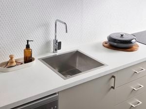 Single stainless steel kitchen sink & tap in kitchen display