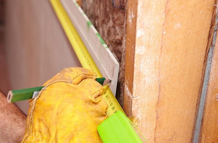 A second row of villaboard being marked out for installation