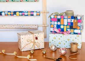 Wrappped presents in front of wrapping station