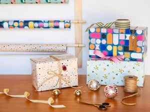 Wrappped presents in front of wrapping station