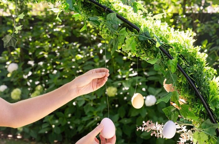 Adding Easter eggs to a garden arch