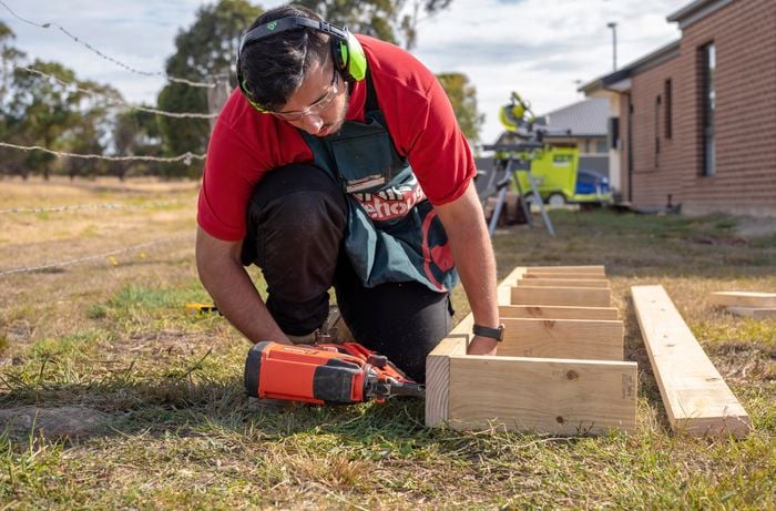 A subfloor being assembled by a Bunnings team member