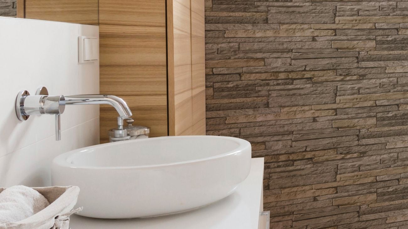 Ledgestone wallpaper in bathroom with basin.