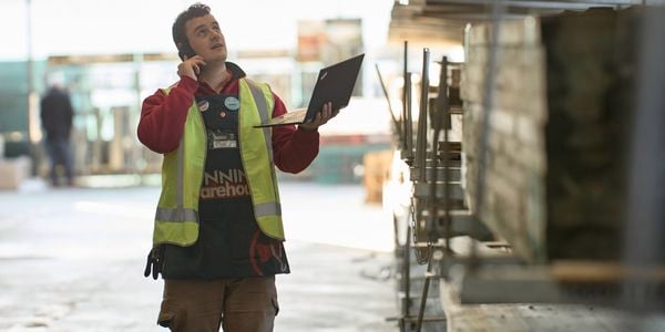 Male Bunnings team member in timber yard at warehouse