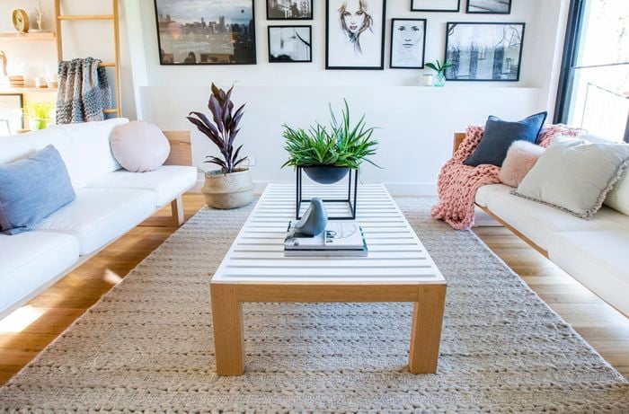 Lounge room with two lounges facing each other and a slat coffee table
