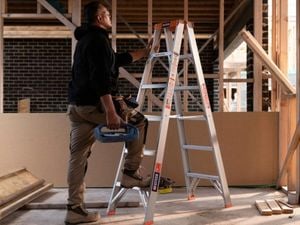 man on a ladder on a site