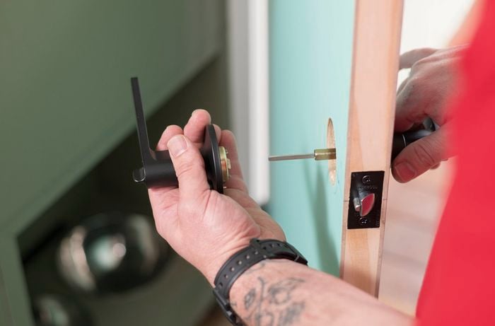 Fit the door handle on a wooden door 