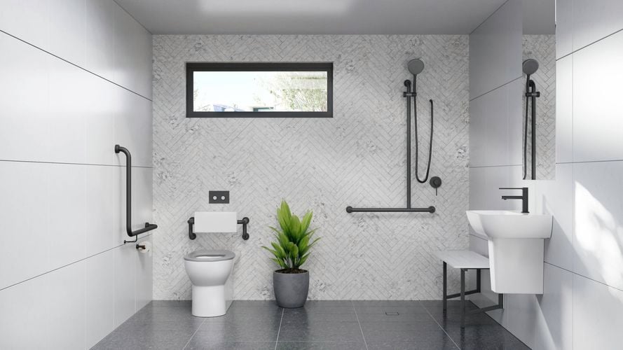 A white bathroom, with a toilet, basin, shower and a pot plant in it.