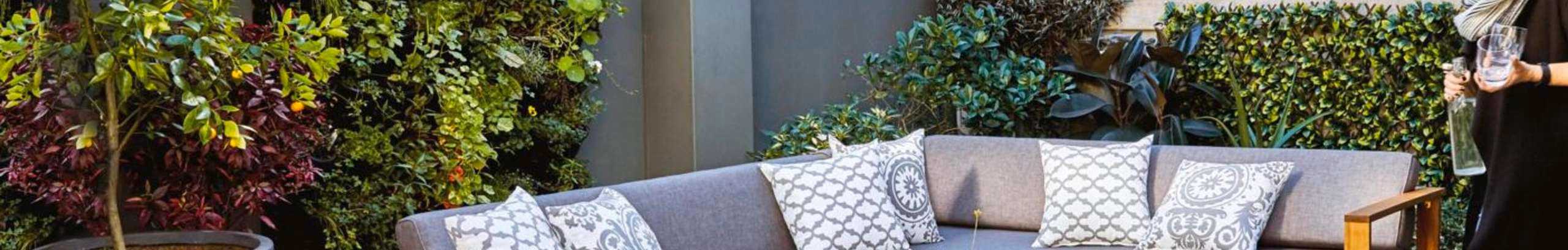 Outdoor area with outdoor setting and vertical wall garden