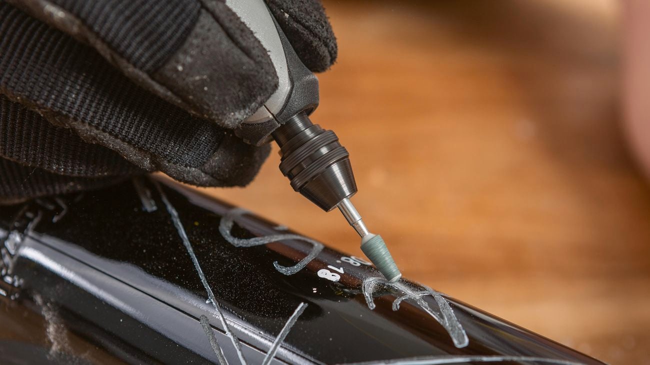 Dremel rotary tool engraving a glass bottle