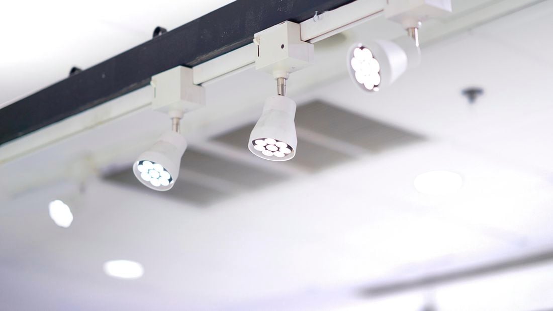 Three ceiling LED lights in a track