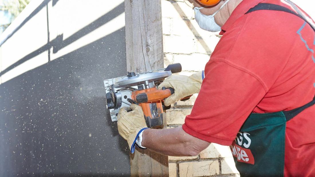 Person sanding timber plinth.