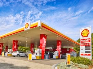 A wide shot of a Shell service station to promote the Shell Card Lite fuel discount on the new PowerPass Pro Rewards program.