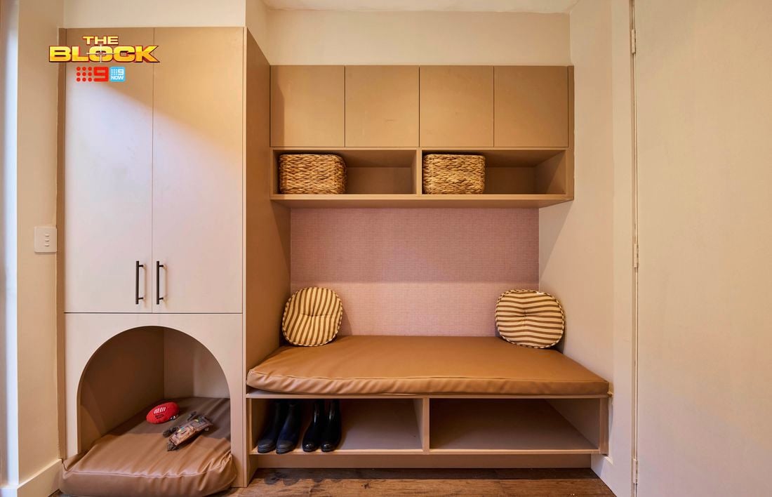 Mudroom from The Block with built-in bench, storage cupboards, baskets, shoe space, and pet nook.