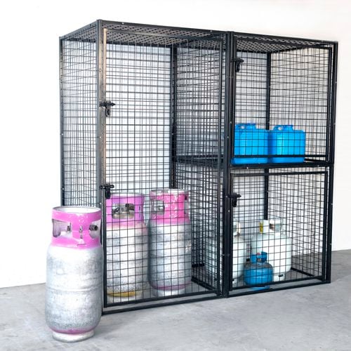 Gas cylinders and cans of paint stored in a secure cage combo.