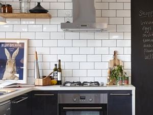 Kitchen bench with cookware and an open cookbook on it