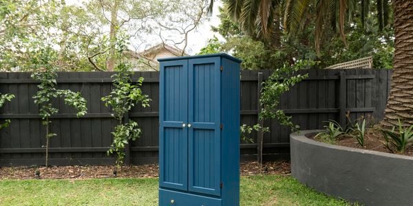 Freshly painted wardrobe in middle of lawn