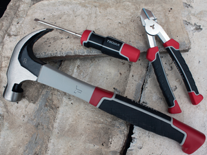 Close-up of Trojan hammer, screwdriver and pliers