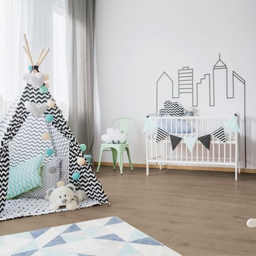 Kids room with teepee, white cot and soft furnishings on light timber look floorboards.