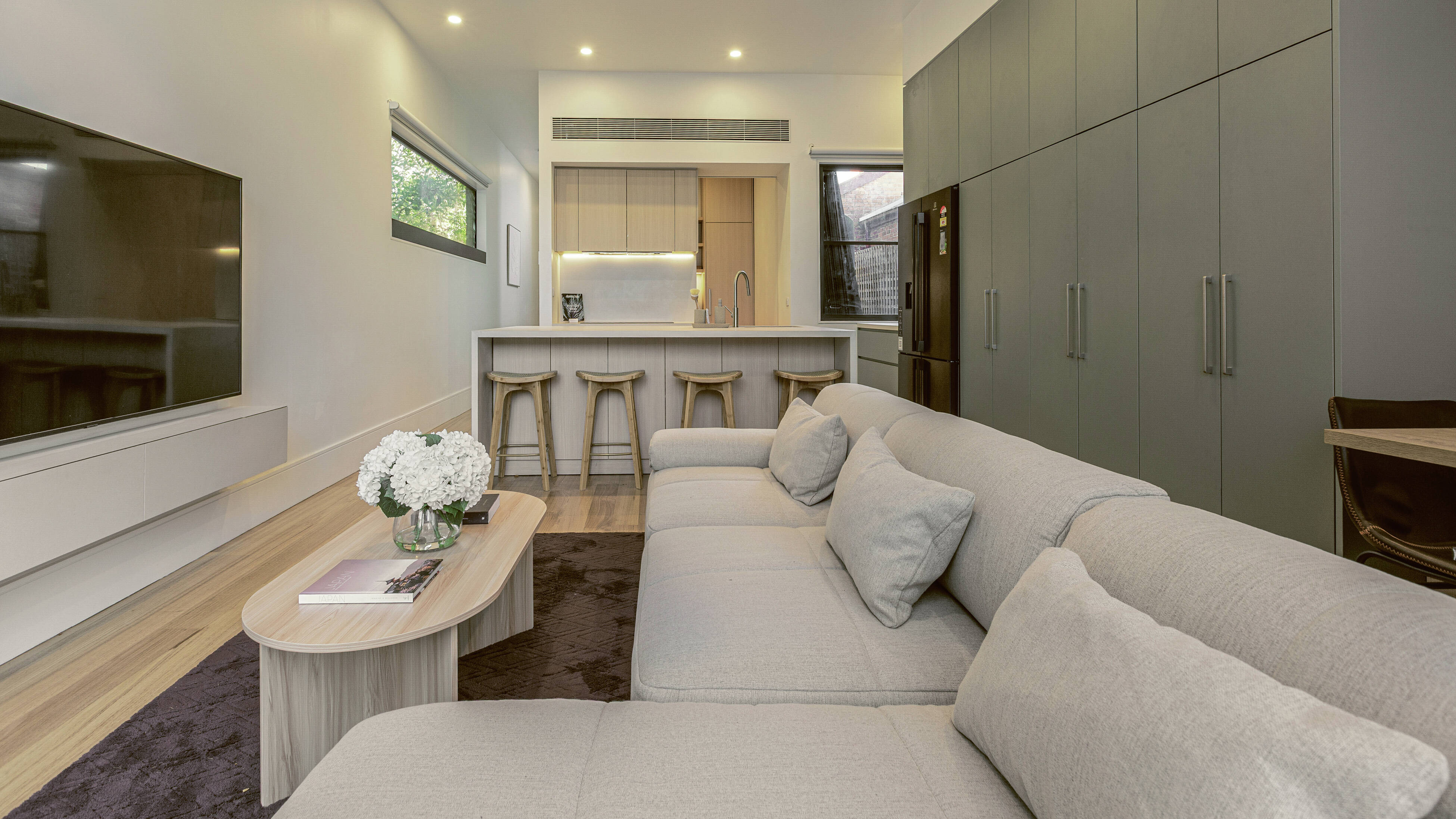 Soft furnishings such as cushions and rugs create an inviting mood. 