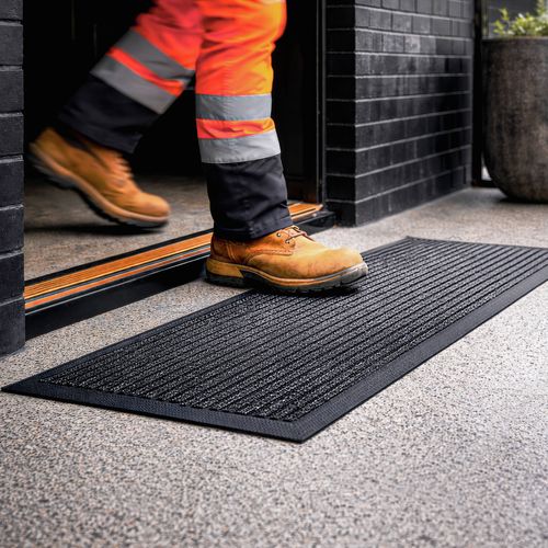 Door mat with absorbant synthetic surface. Easily maintain by shaking dust away or hosing clean.