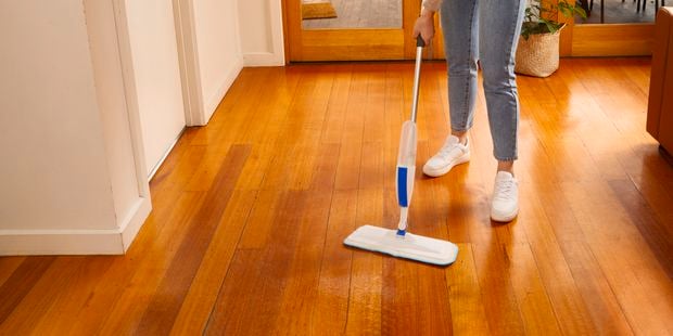 woman mopping the floor
