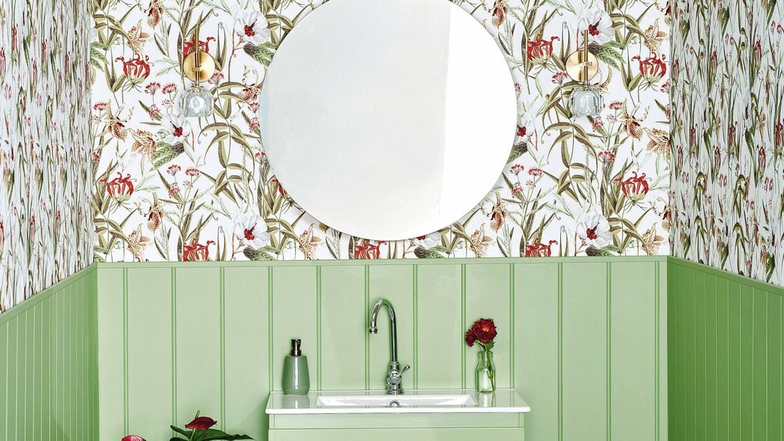 powder room with floral wallpaper and green timber wall panelling