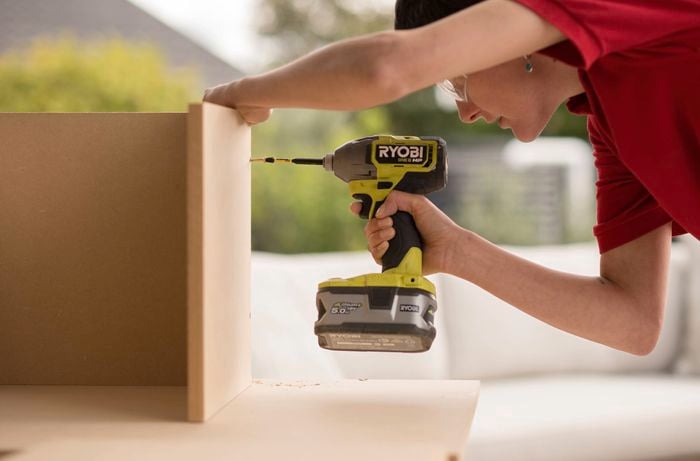 Drill to create holes in the wooden base.