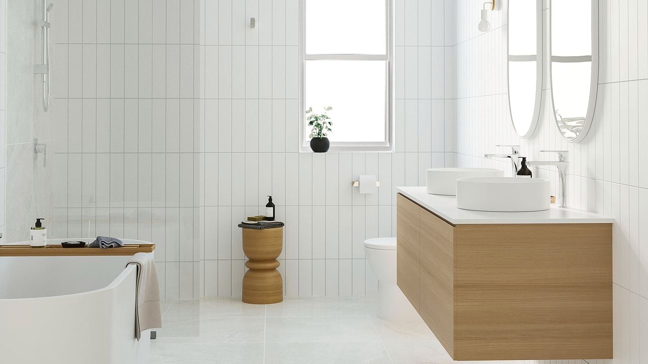 Scandi style bathroom featuring a double basin vanity and pill shaped mirrors.